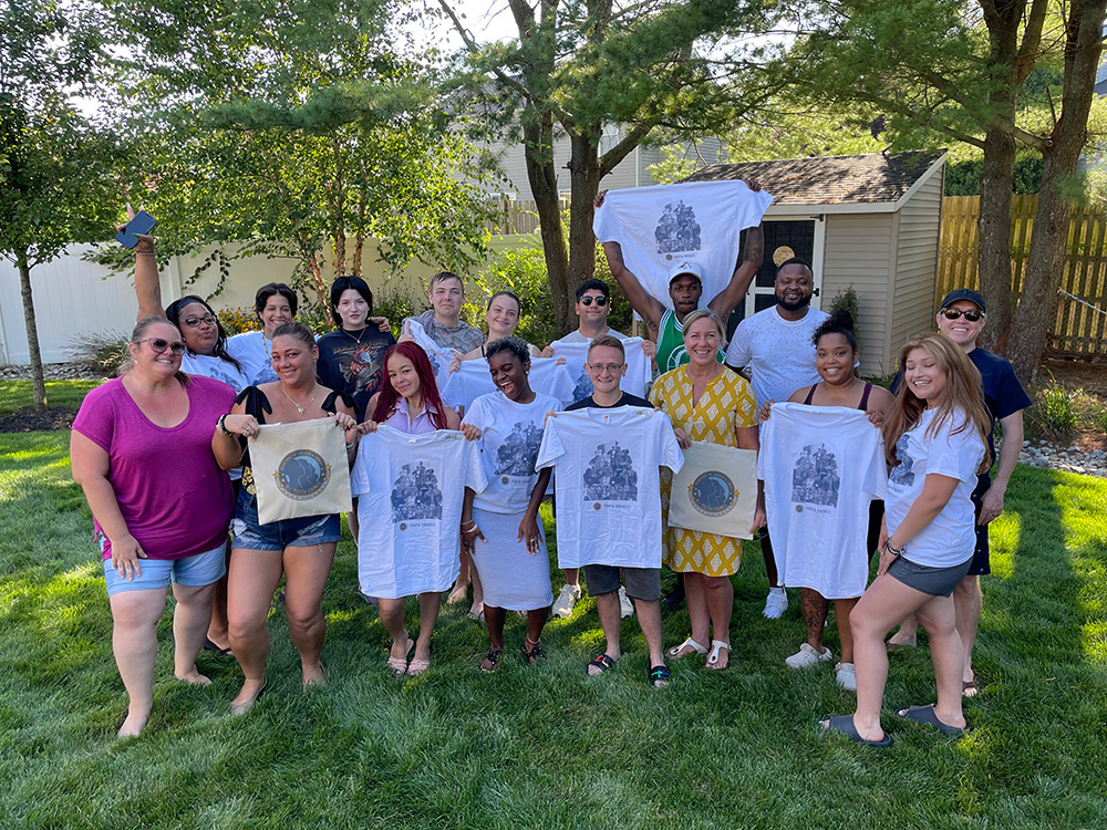 NJYRS members holding up t-shirts